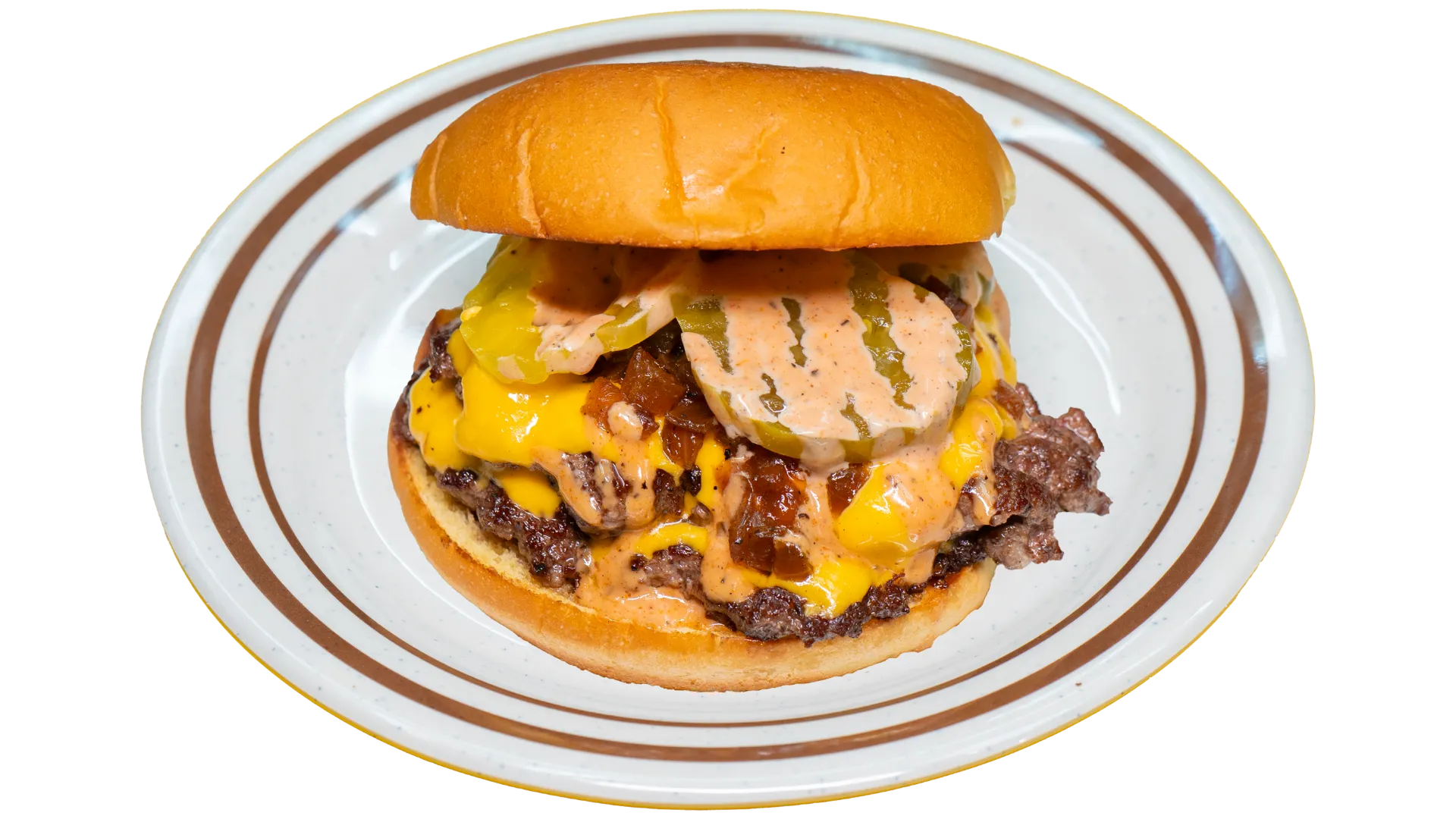 Juicy cheeseburger with lettuce, tomato, and toasted bun