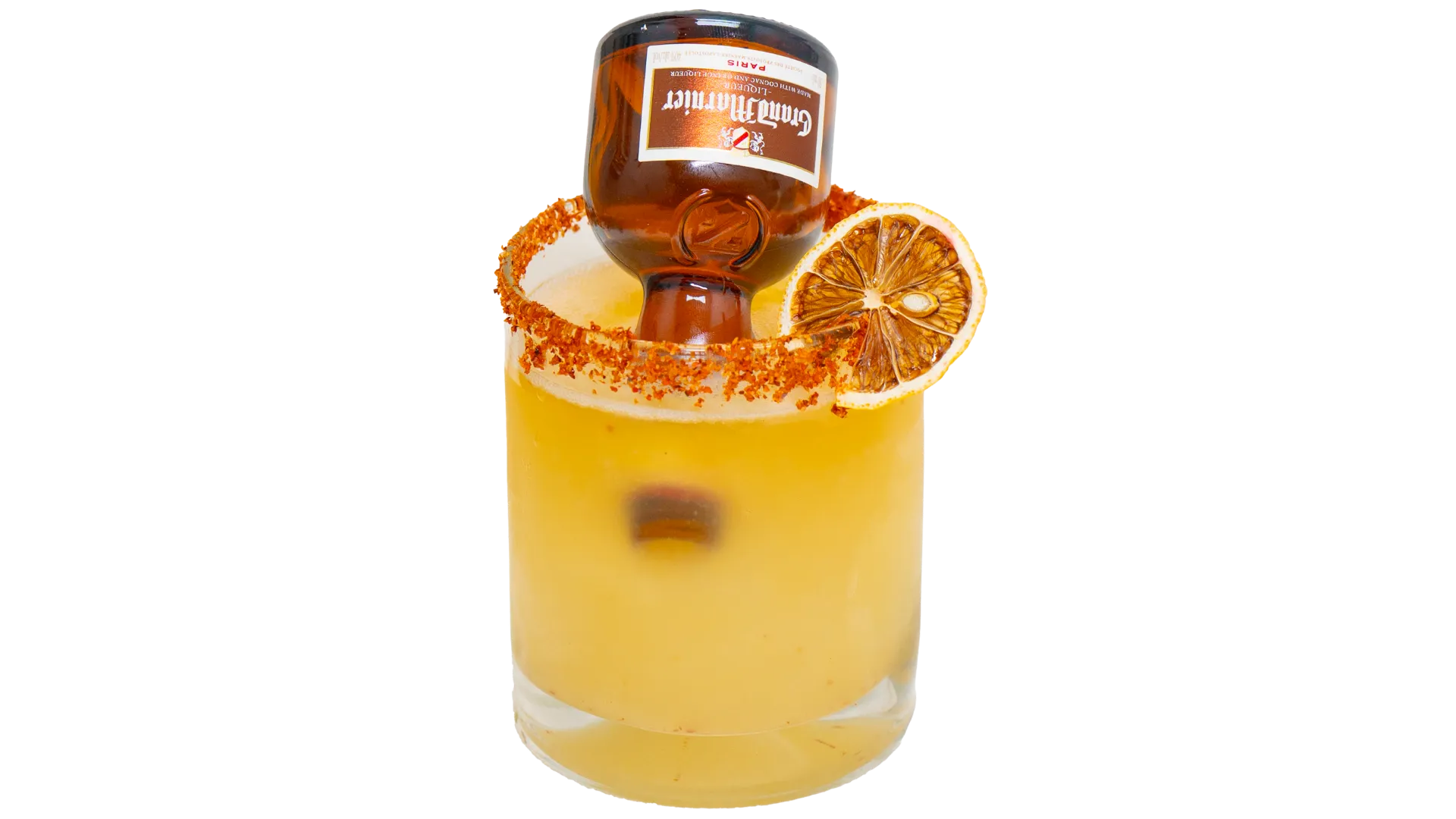 Cadillac margarita served with lime wedge and salted rim